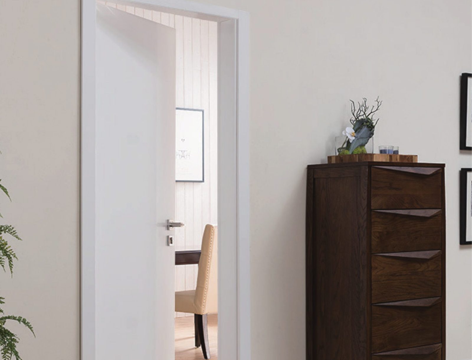 Open white interior door in painted casing